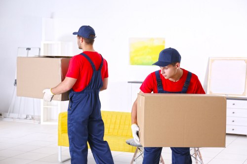 Removal team preparing a Lambeth home move with boxes and furniture