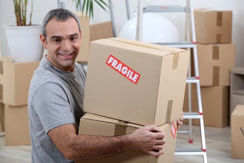 Helper loading household furniture for a Lambeth relocation