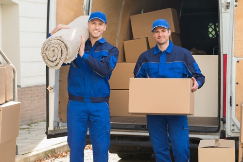 Furniture removals team planning a move in a Lambeth street