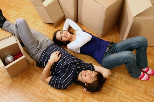 Professional movers handling household items during a local move